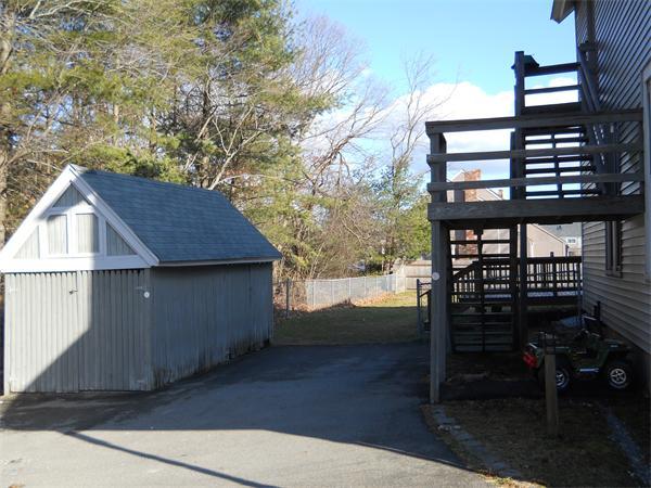 156 Ayer Road Shirley, MA 01464 - Photo 8 of 10 a view of a house with backyard porch and sitting area