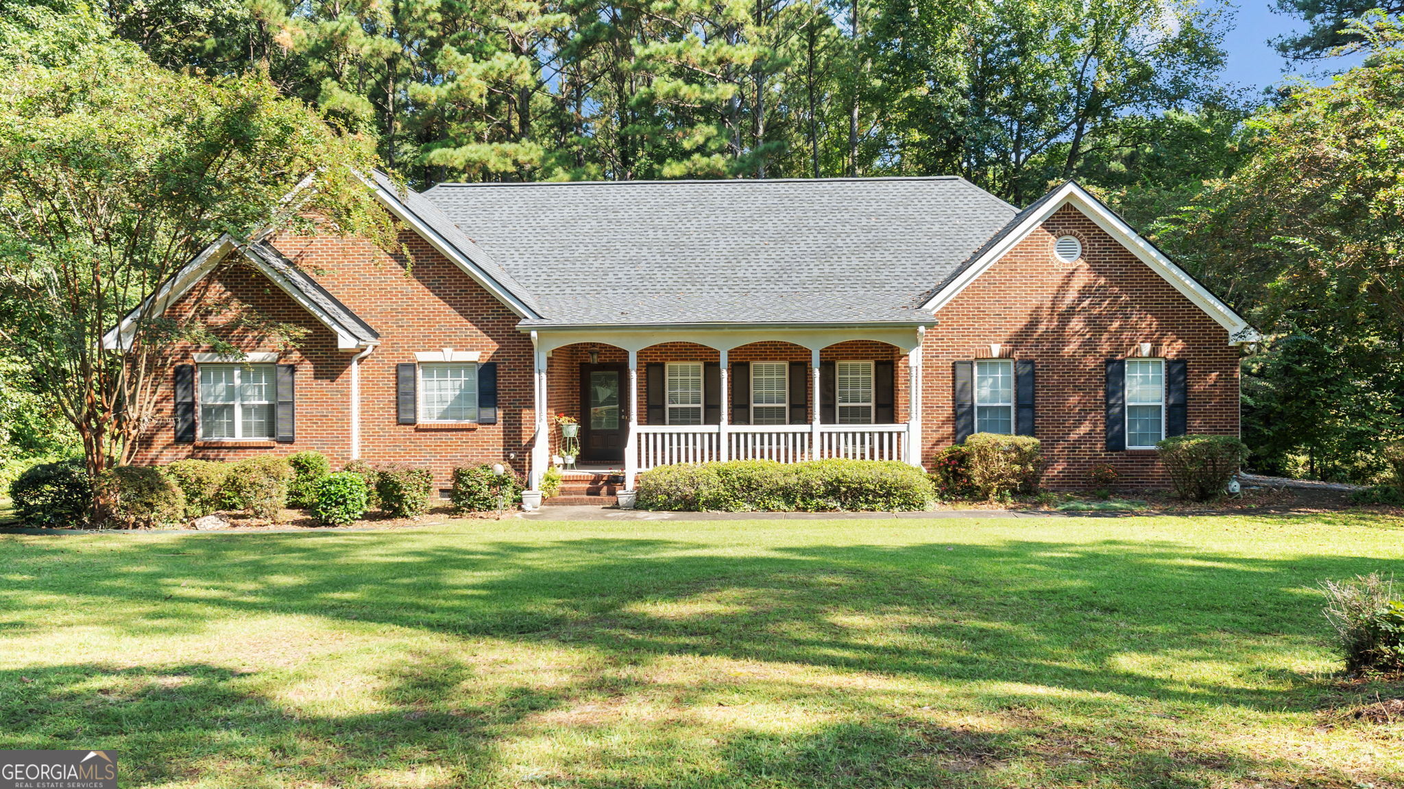 2987 Steele Road Griffin, GA 30223 - Photo 8 of 22 a front view of a house with a yard