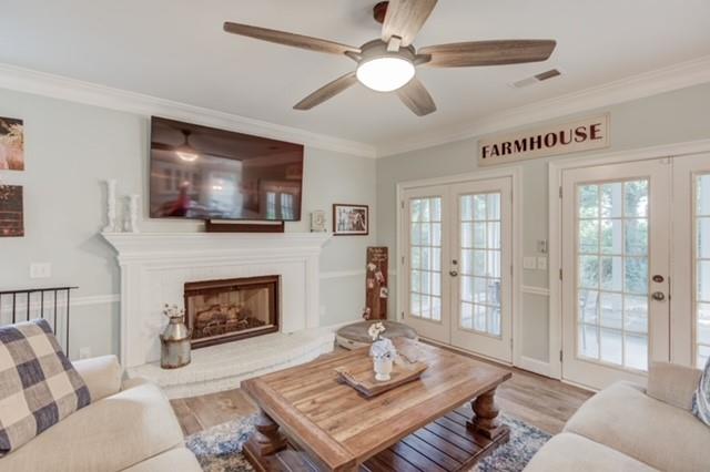 1727 Bakers Mill Road Dacula, GA 30019 - Photo 12 of 39 a living room with furniture a flat screen tv and a fireplace
