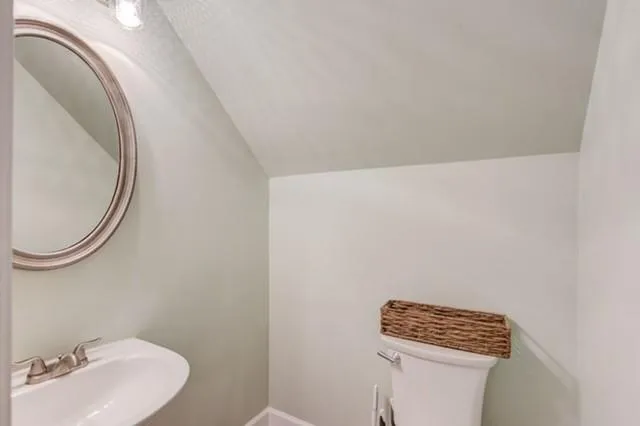 a bathroom with a toilet and a sink
