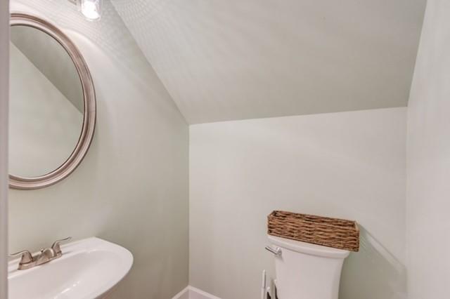 1727 Bakers Mill Road Dacula, GA 30019 - Photo 13 of 39 a bathroom with a toilet and a sink