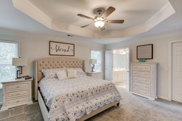 1727 Bakers Mill Road Dacula, GA 30019 - Photo 16 of 39 a bedroom with a bed a chandelier and a dresser