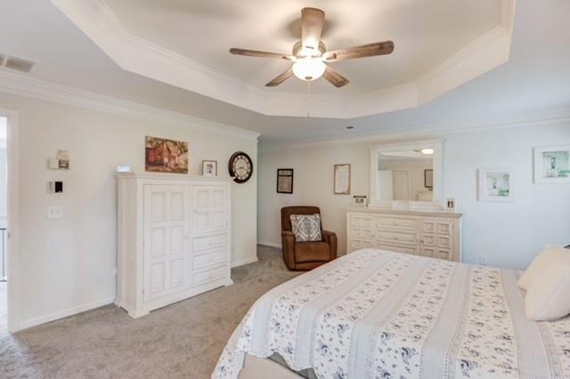 1727 Bakers Mill Road Dacula, GA 30019 - Photo 17 of 39 a bedroom with a large bed and a chandelier