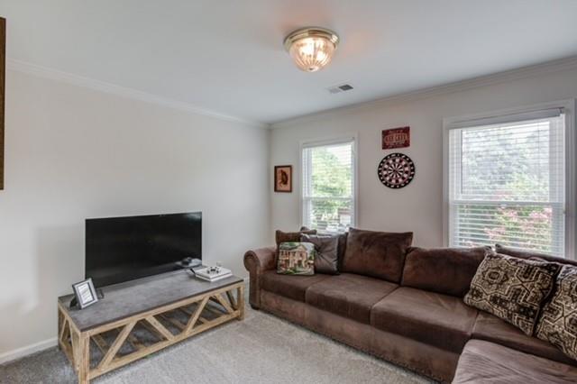 1727 Bakers Mill Road Dacula, GA 30019 - Photo 24 of 39 a living room with furniture and a flat screen tv