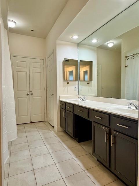 1727 Bakers Mill Road Dacula, GA 30019 - Photo 26 of 39 a spacious bathroom with a double vanity sink a mirror and a bathtub
