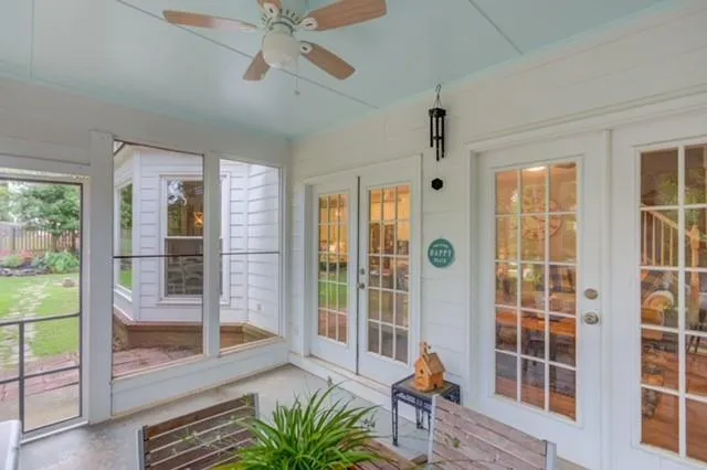 a view of an entryway with wooden floor and windows