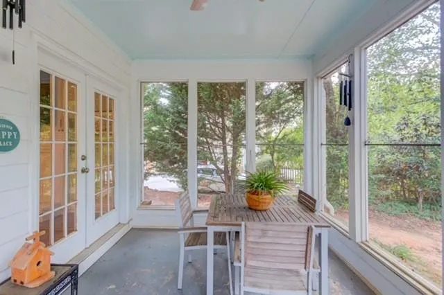 a view of a backyard with large trees