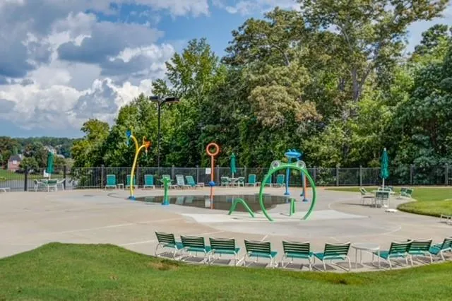 a view of a wooden chairs and table in the patio