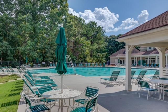 1727 Bakers Mill Road Dacula, GA 30019 - Photo 35 of 39 a view of a wooden chairs and table in the patio
