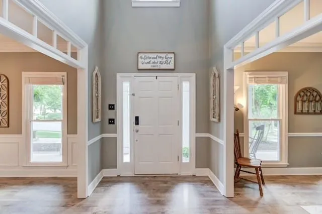 a view of front door with wooden floor
