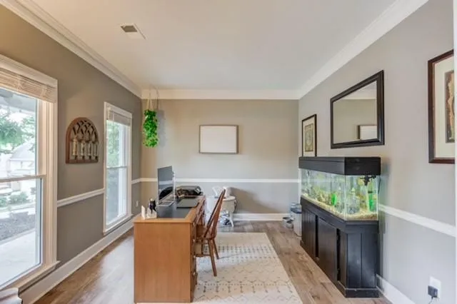 a dining room with furniture and window