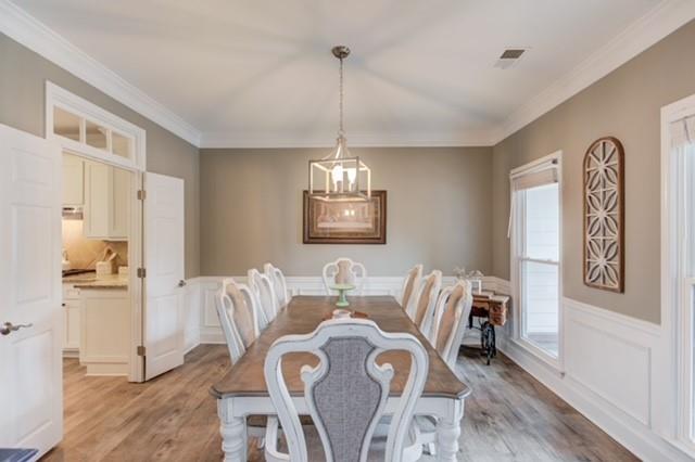 1727 Bakers Mill Road Dacula, GA 30019 - Photo 7 of 39 a view of a dining room with furniture window and wooden floor