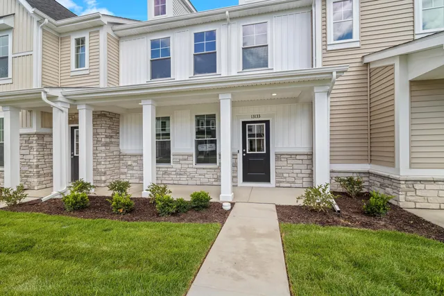 a front view of a house with yard
