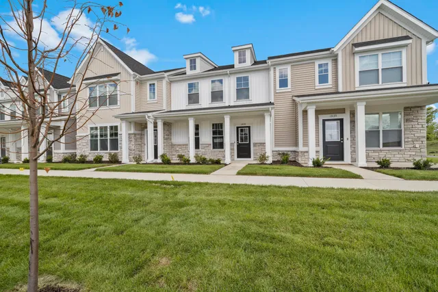 a front view of a house with swimming pool and porch