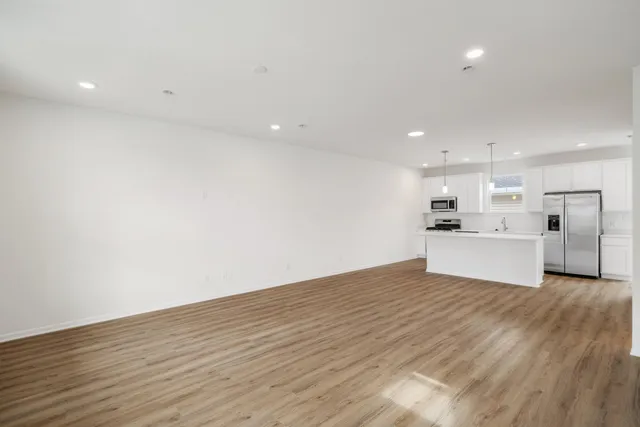 a view of kitchen with wooden floor