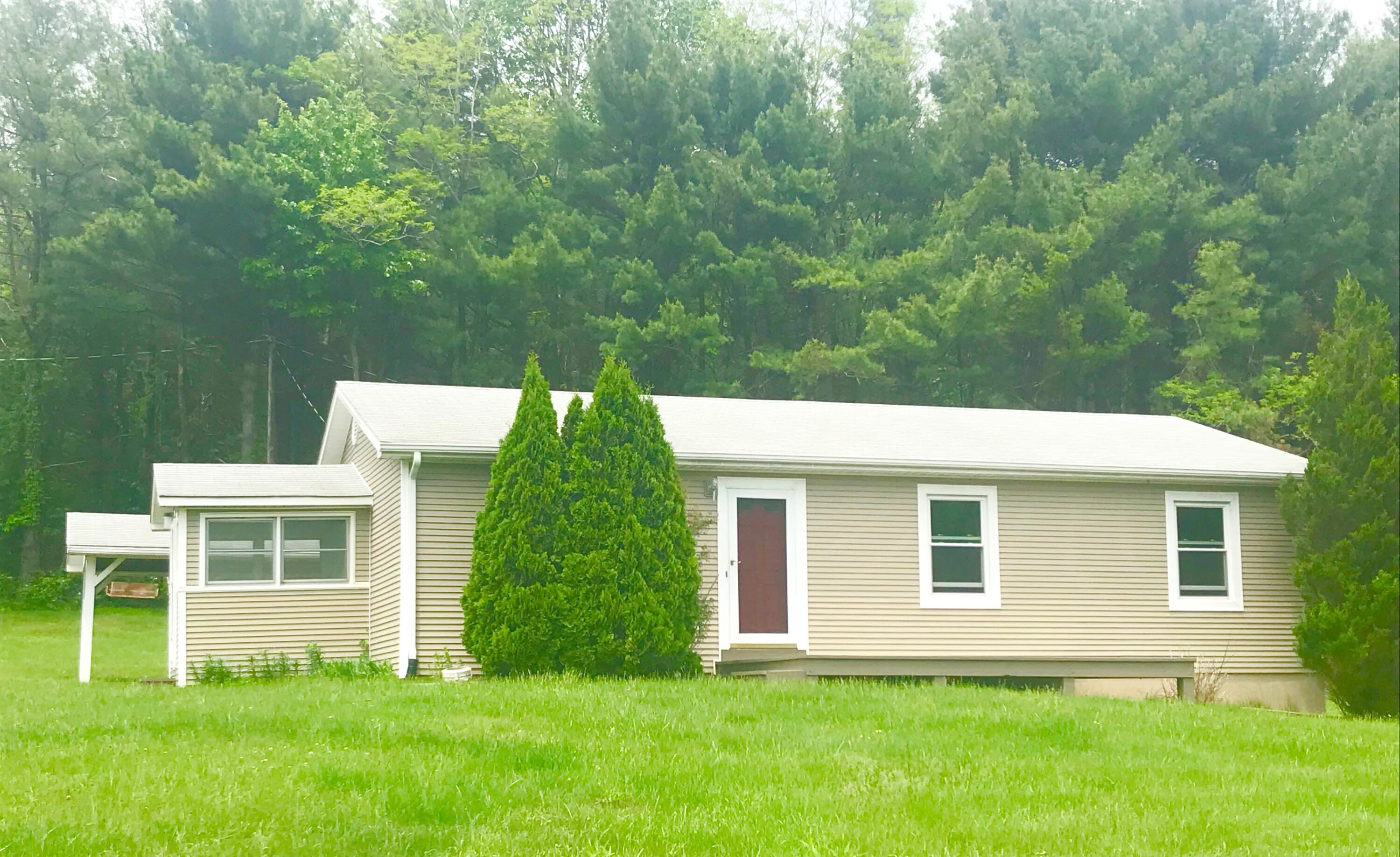 a view of a house with a yard