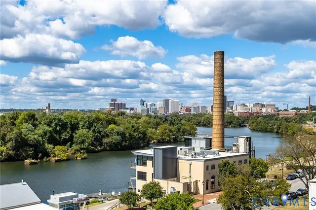 a view of a lake with a city skyline in the background