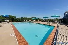 a view of a swimming pool with a patio