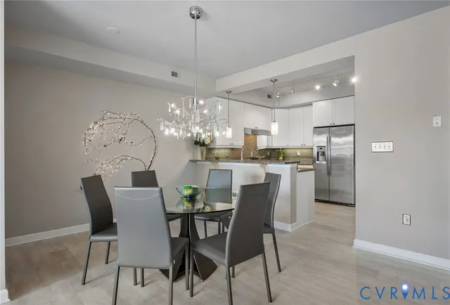 a view of a dining room and chandelier
