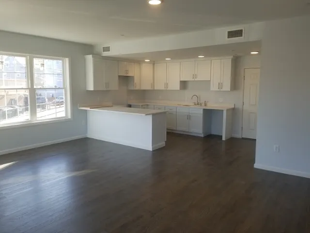 a large kitchen with a large window