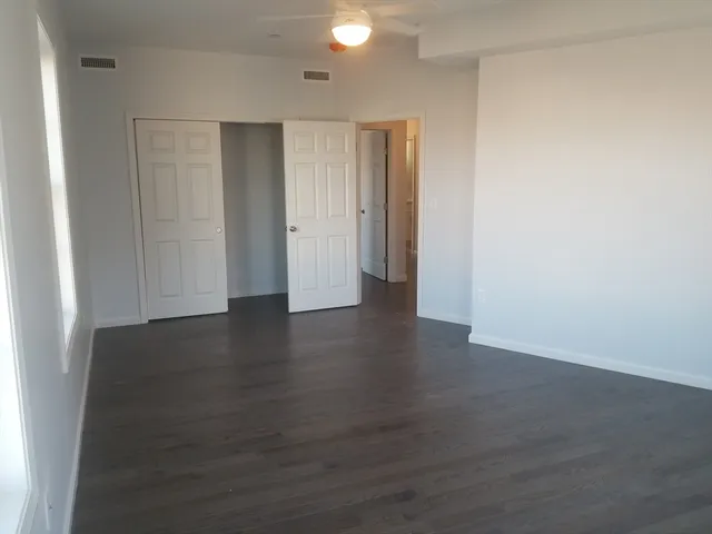 a view of a livingroom with wooden floor