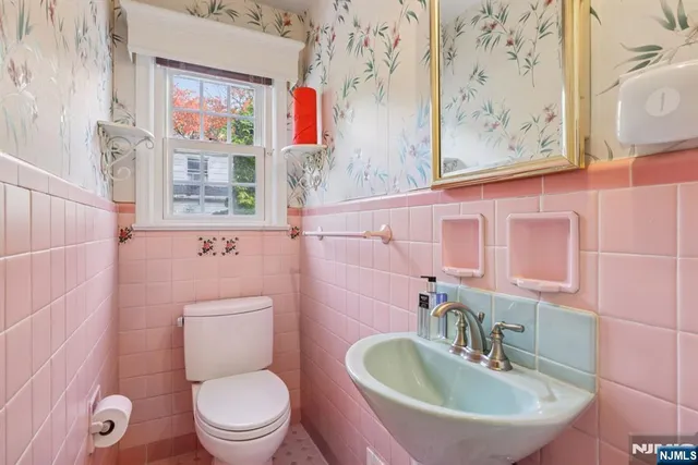 a view of entryway with window and stairs