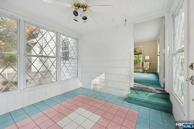 a bathroom with a granite countertop toilet sink and mirror