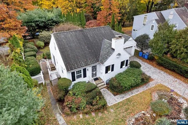 an aerial view of a house with a garden