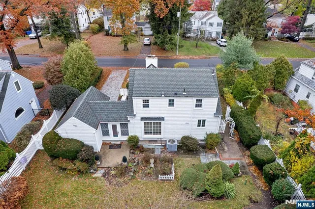 an aerial view of swimming pool yard and outdoor seating