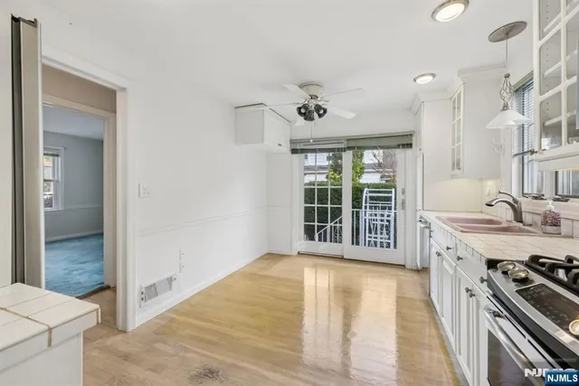 a view of a kitchen with a sink and a stove