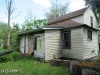 6545 Norwalk Road Medina, OH 44256 - Photo 3 of 10 Rear view of house featuring a yard