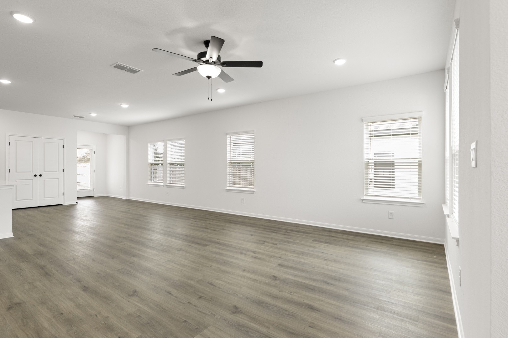 3717 Pin Oak Hills Seguin, TX 78155 - Photo 10 of 22 a view of an empty room with wooden floor and a window