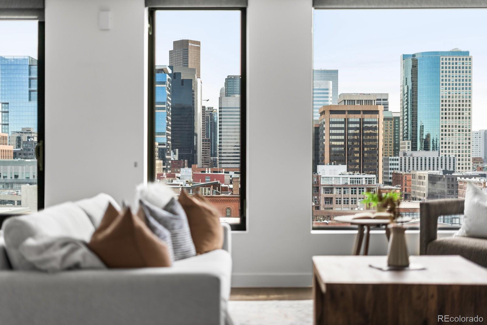 1750 Wewatta Street, Unit 1030 Denver, CO 80202 - Photo 19 of 50 a living room with furniture and a table
