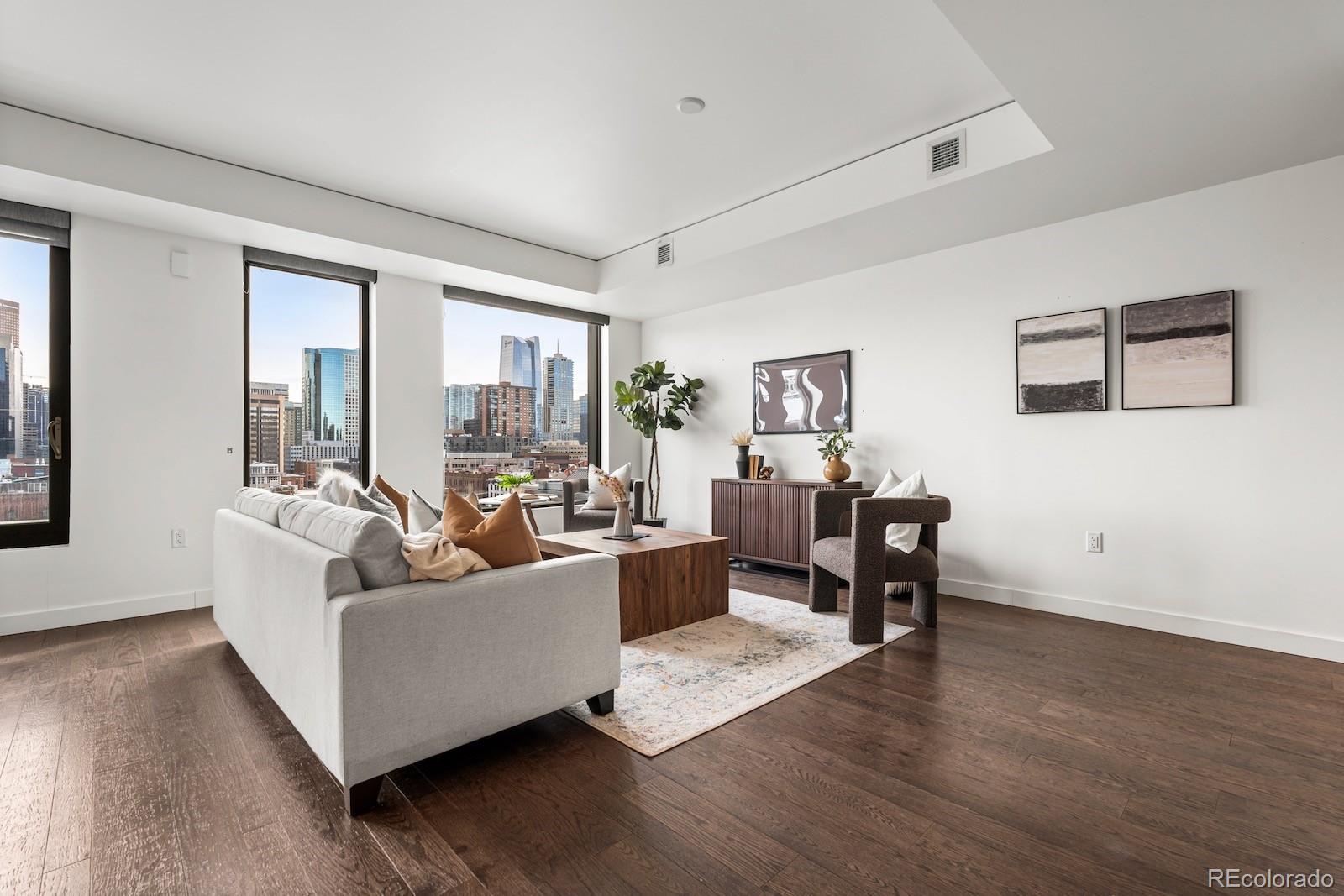 1750 Wewatta Street, Unit 1030 Denver, CO 80202 - Photo 3 of 50 a living room with furniture and a large window
