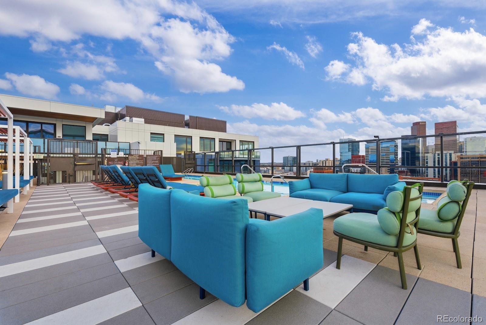 1750 Wewatta Street, Unit 1030 Denver, CO 80202 - Photo 38 of 50 a view of a roof deck with couches and potted plants