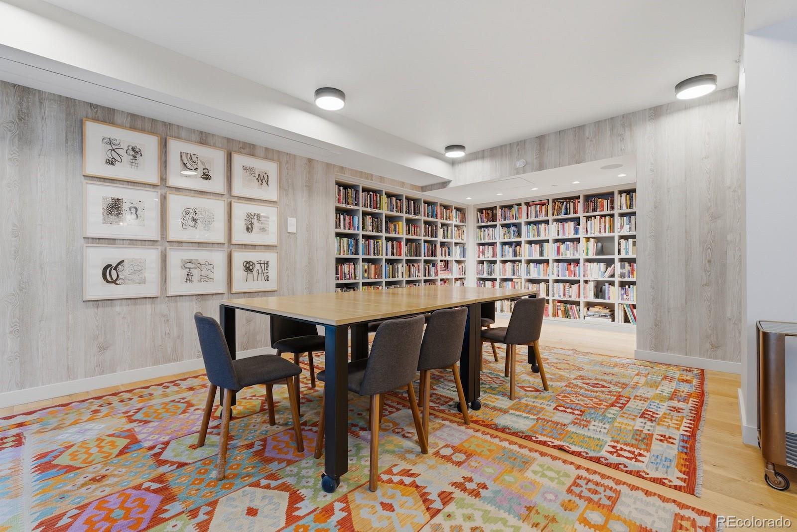1750 Wewatta Street, Unit 1030 Denver, CO 80202 - Photo 46 of 50 a view of a dining room with furniture and wooden floor