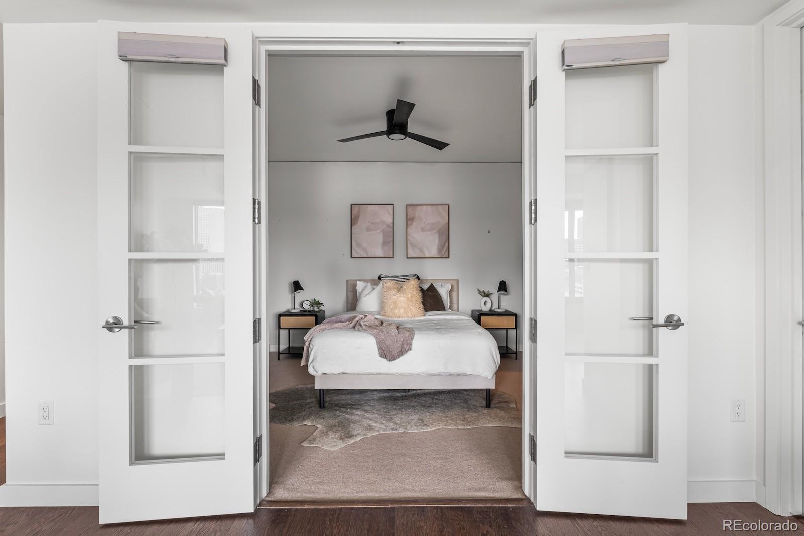 1750 Wewatta Street, Unit 1030 Denver, CO 80202 - Photo 7 of 50 a living room with furniture and a wooden floor