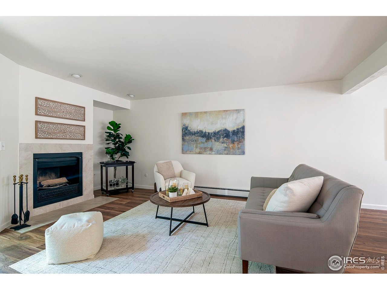 3054 Edison Court Boulder, CO 80301 - Photo 36 of 36 a living room with furniture and a fireplace