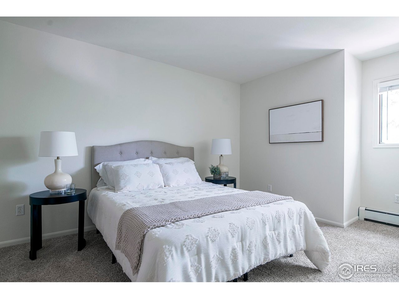 3054 Edison Court Boulder, CO 80301 - Photo 15 of 36 a bedroom with a bed and a lamp