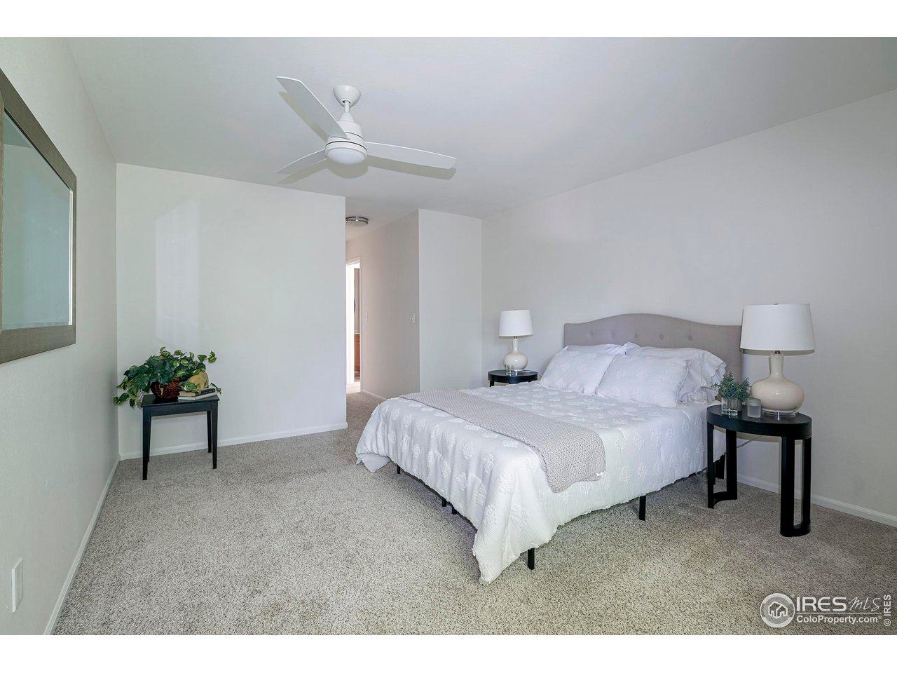3054 Edison Court Boulder, CO 80301 - Photo 16 of 36 a bedroom with a bed and a table