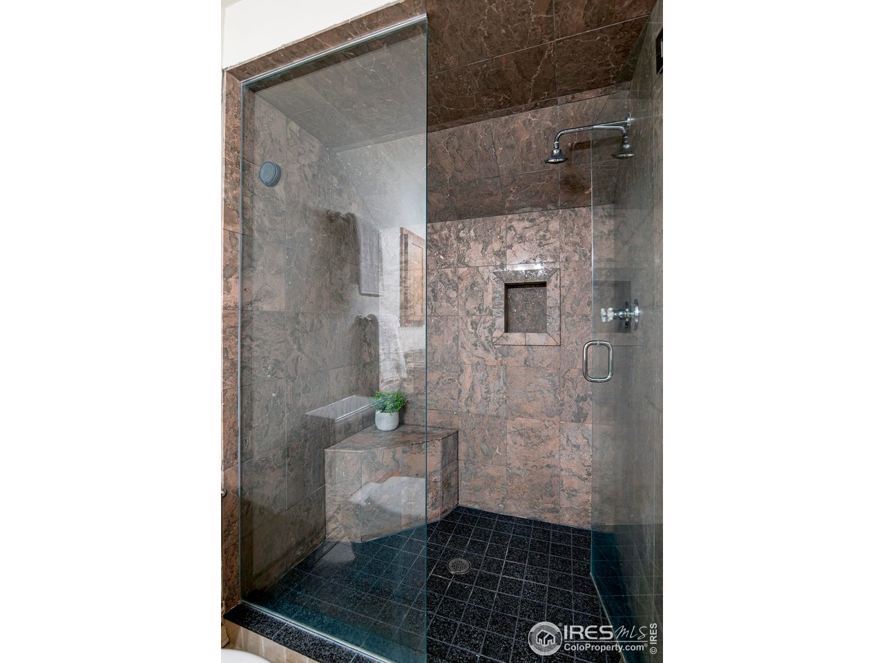 3054 Edison Court Boulder, CO 80301 - Photo 19 of 36 a bathroom with a sink and a mirror