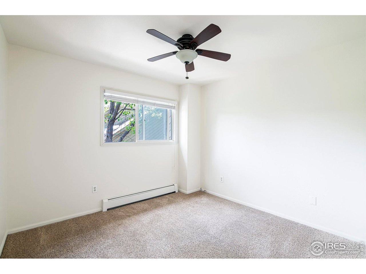 3054 Edison Court Boulder, CO 80301 - Photo 23 of 36 an empty room with wooden floor and ceiling fan