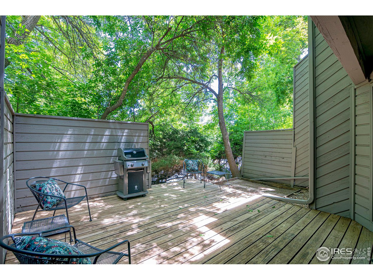 3054 Edison Court Boulder, CO 80301 - Photo 30 of 36 a backyard of a house with table and chairs