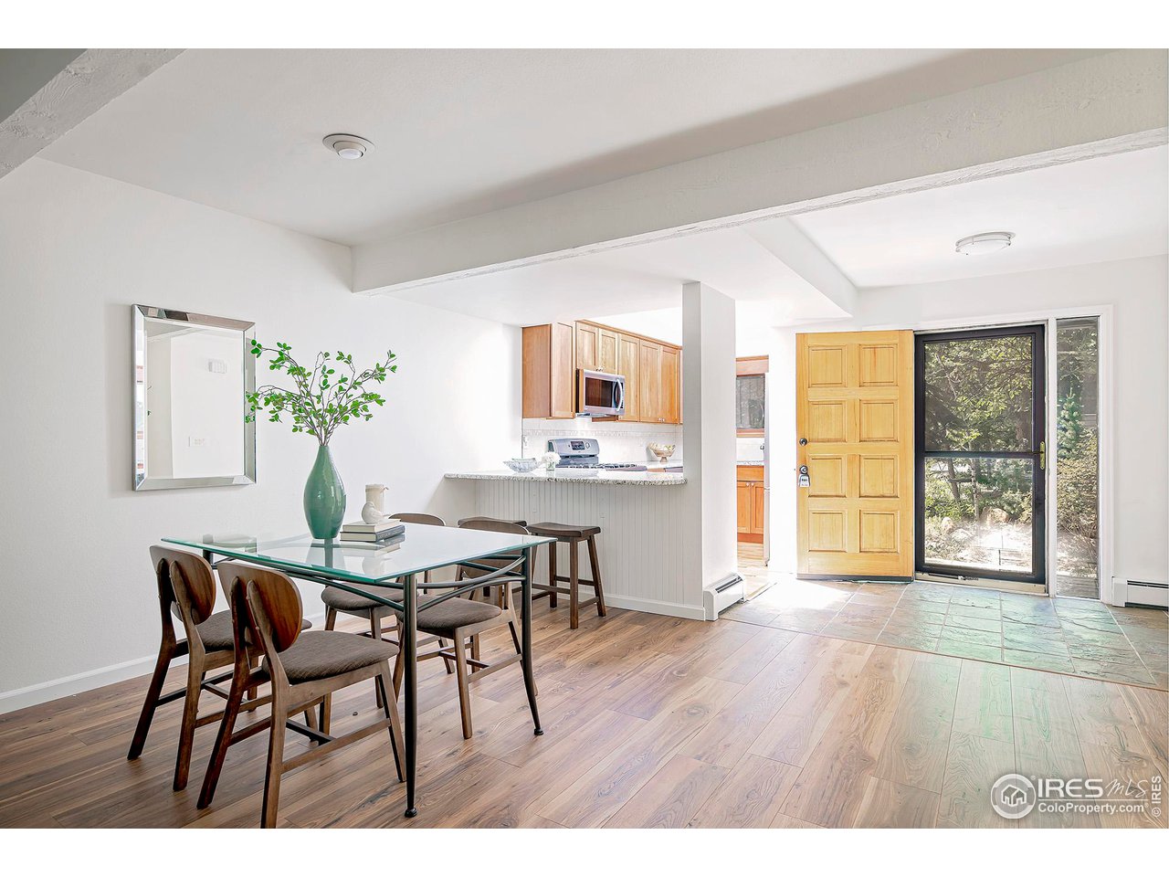 3054 Edison Court Boulder, CO 80301 - Photo 4 of 36 a view of a dining room with furniture and wooden floor
