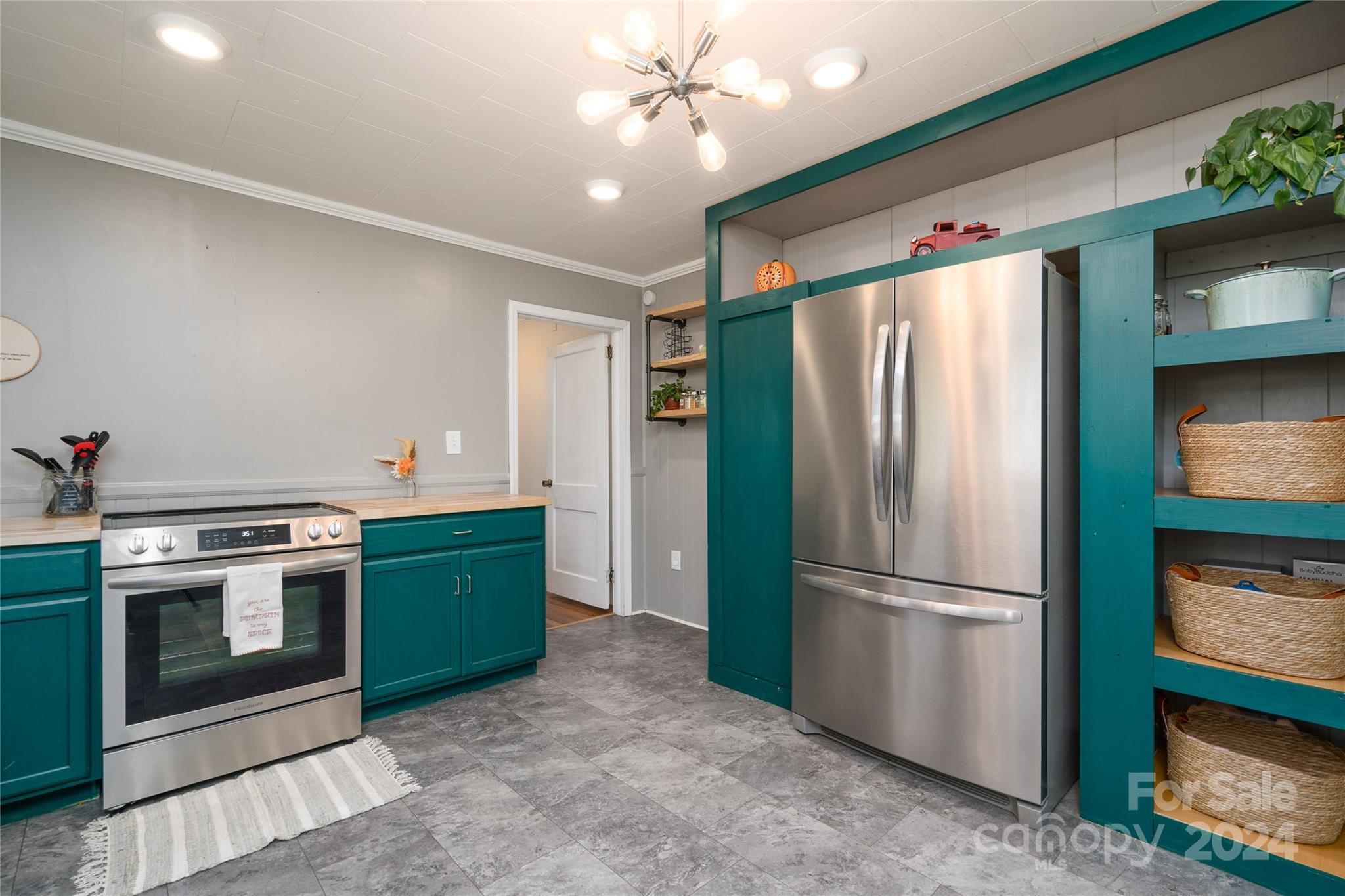 2176 Old Hickory Grove Road Mount Holly, NC 28120 - Photo 13 of 34 a kitchen with stainless steel appliances granite countertop a refrigerator a stove and a sink