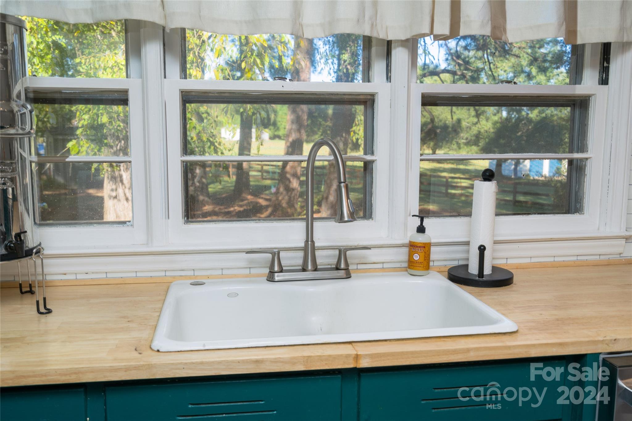 2176 Old Hickory Grove Road Mount Holly, NC 28120 - Photo 16 of 34 a kitchen with a sink and large window