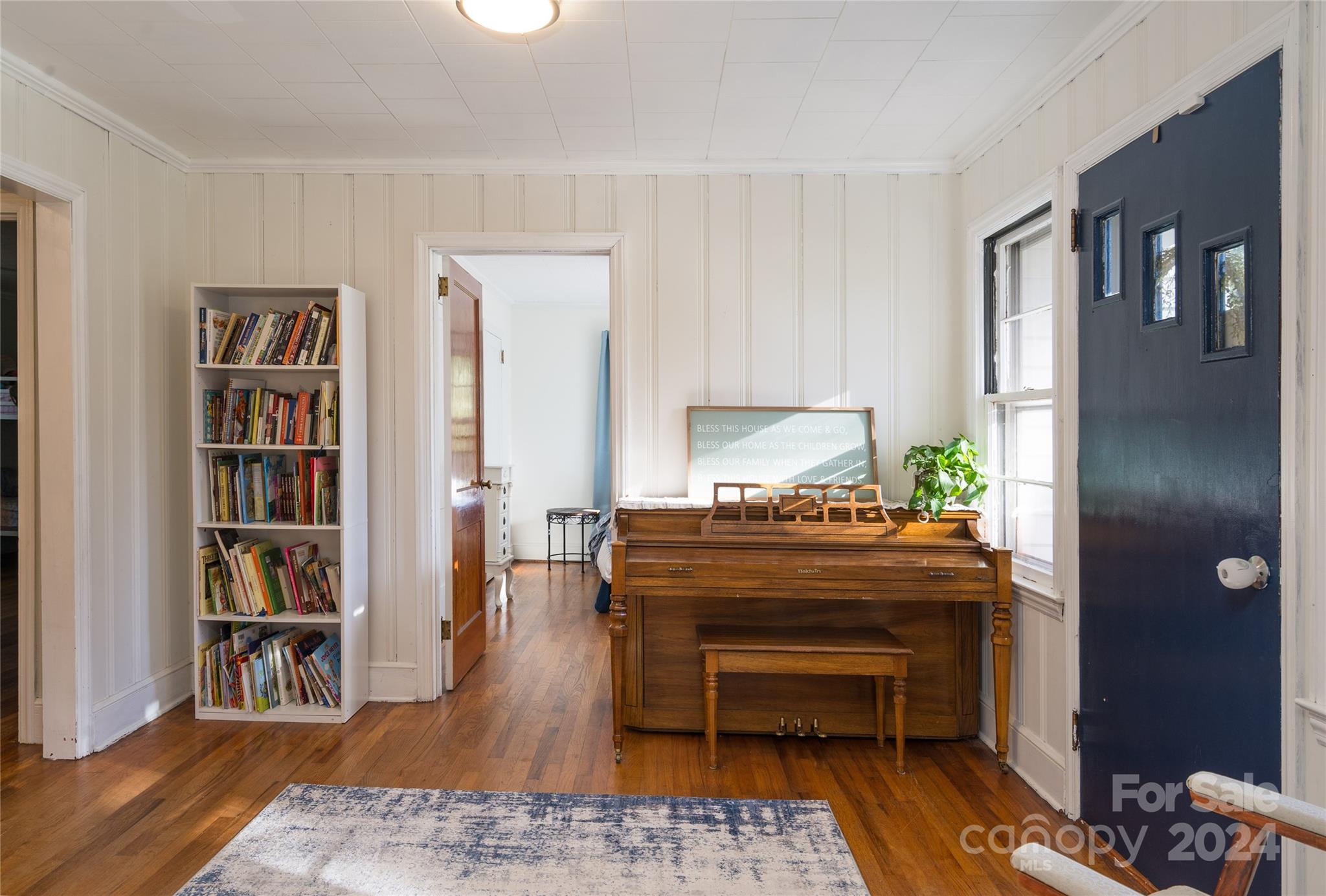 2176 Old Hickory Grove Road Mount Holly, NC 28120 - Photo 19 of 34 a living room with furniture and a book shelf