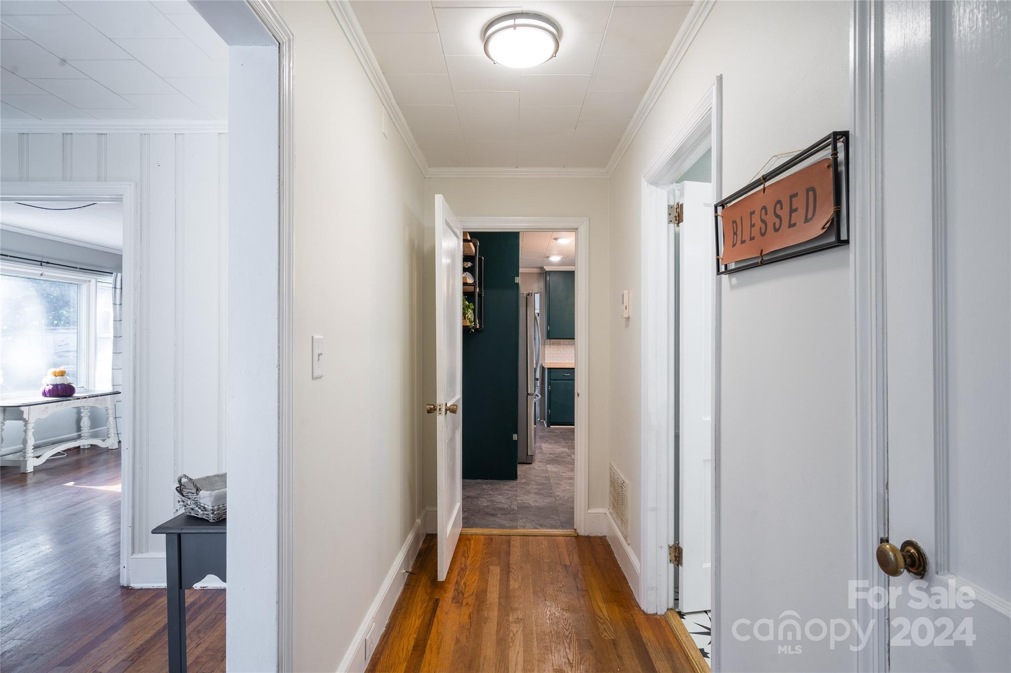 2176 Old Hickory Grove Road Mount Holly, NC 28120 - Photo 23 of 34 a view of a hallway to a livingroom with wooden floor and furniture