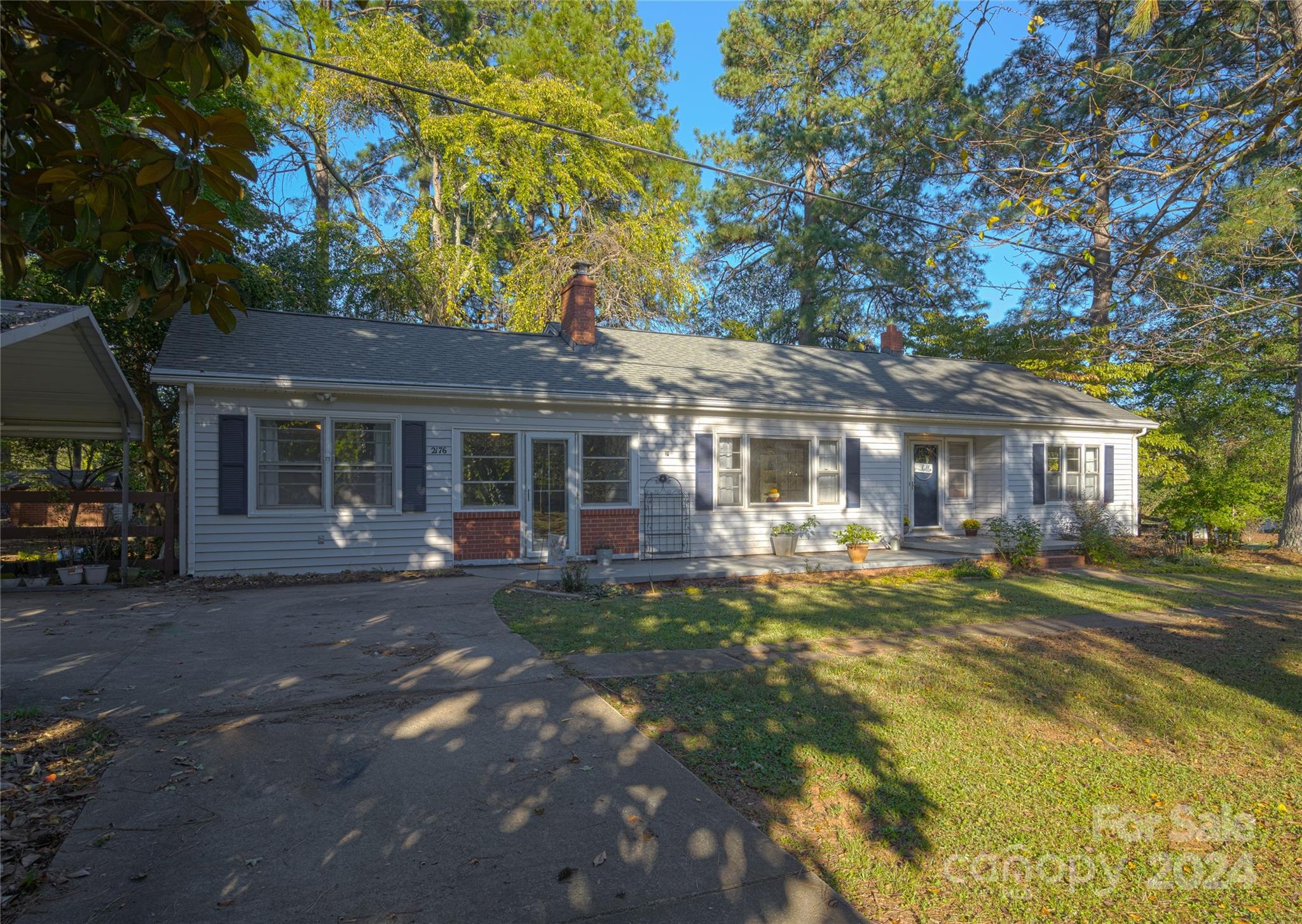 2176 Old Hickory Grove Road Mount Holly, NC 28120 - Photo 30 of 34 a front view of a house with a garden