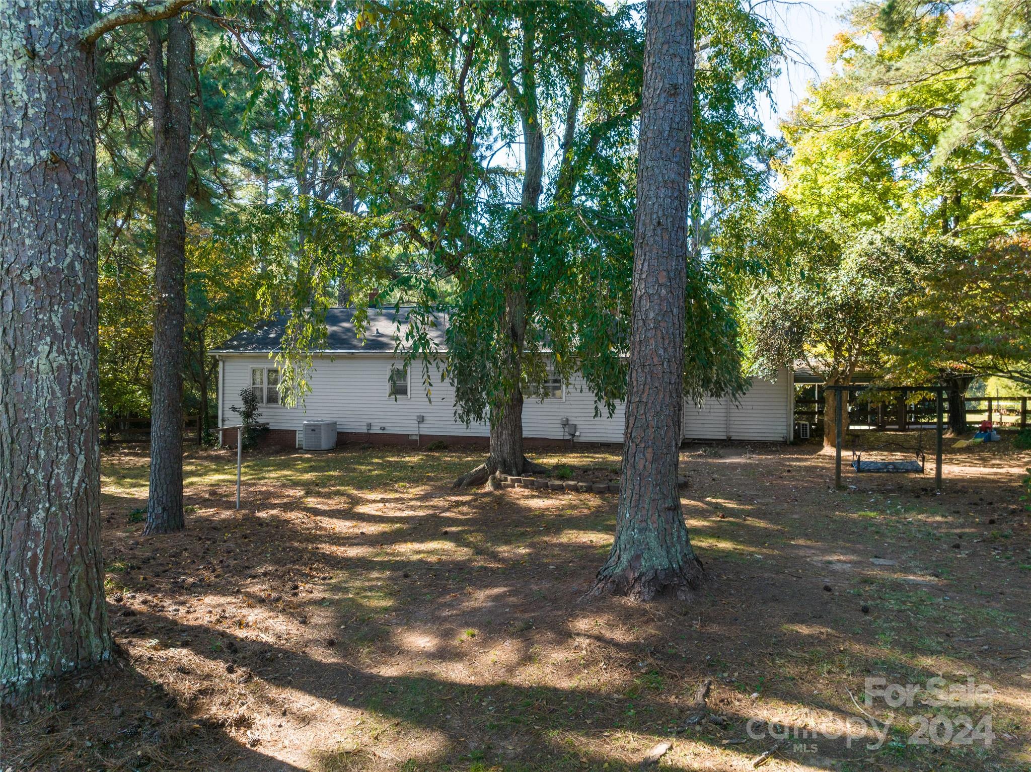 2176 Old Hickory Grove Road Mount Holly, NC 28120 - Photo 33 of 34 a view of a tree in the middle of a yard